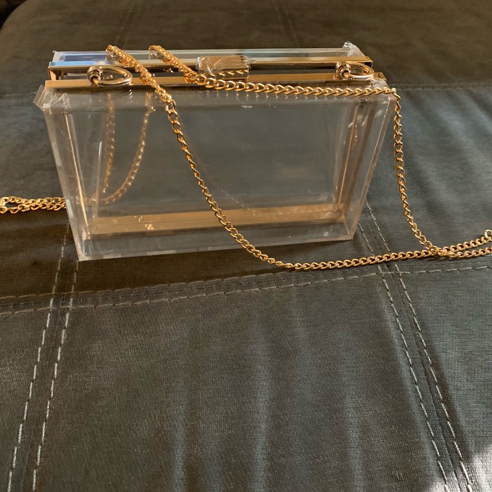 Clear clutch with gold accents